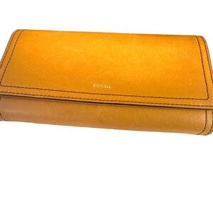 Fossil brand wallet in golden/mustard yellow. Like new.